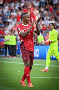 Berlin, Germany - June 29, 2024: Manuel Akanji of Switzerland (#5) thanks fans after the UEFA EURO 2024 Round of 16 game Switzerland v Italy at Olympiastadion in Berlin, Germany