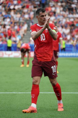 Berlin, Germany - June 29, 2024: Granit Xhaka of Switzerland (#10) in action during the UEFA EURO 2024 Round of 16 game Switzerland v Italy at Olympiastadion in Berlin, Germany