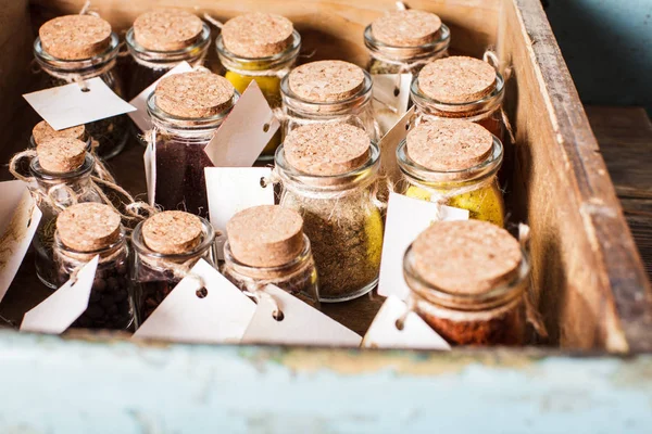 Spices in vintage bottles — Stock Photo, Image