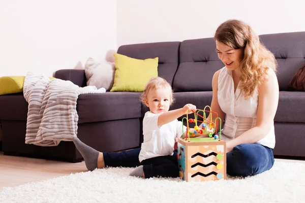 Cute boy wants to play on the carpet — Stock Photo, Image