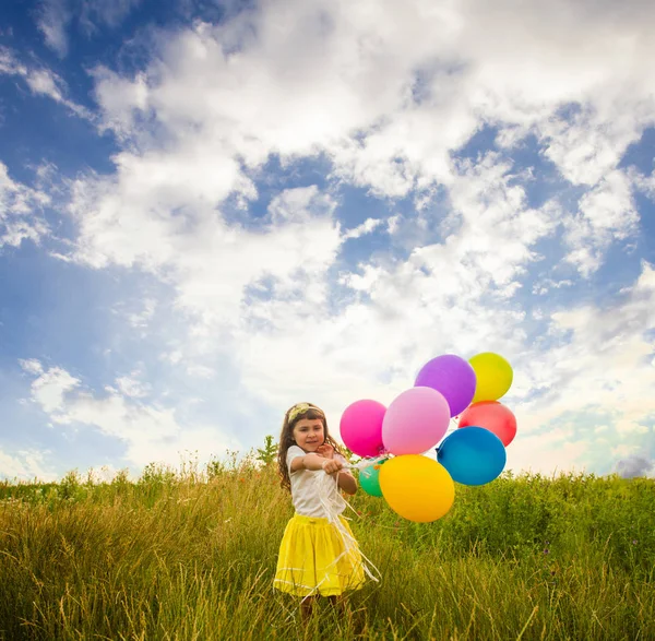 Child with colorful toy balloons — Stock Photo, Image