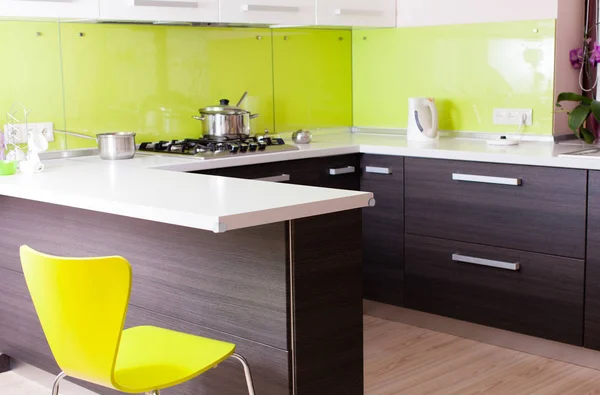 Nice kitchen with great  table worktop and yellow chair Stock Photo