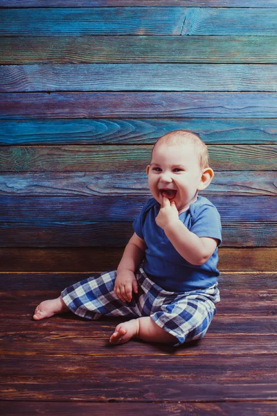 Child with finger in mouth — Stock Photo, Image