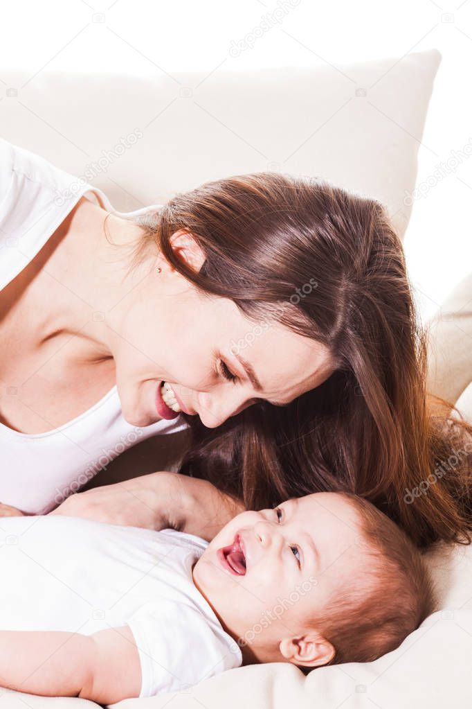 The mom is having fun with baby