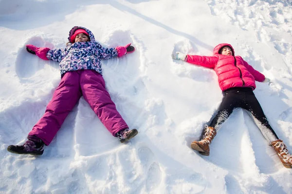 Two angels on the snow — Stock Photo, Image