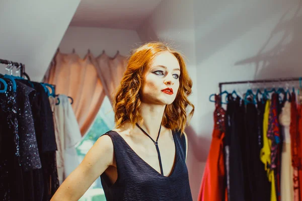 Adorable redhead woman in the dressing room