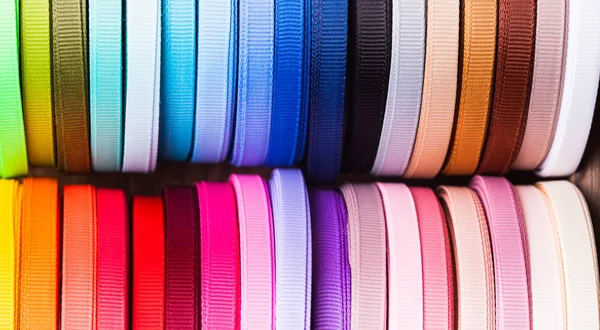 Color ribbon bobbins top view close up — Stock Photo, Image