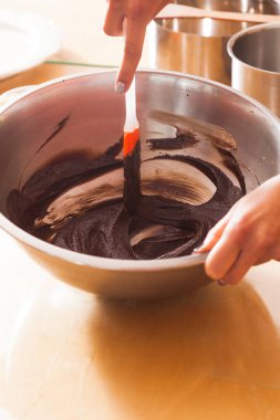 Melting chocolate in a bowl close up clipart