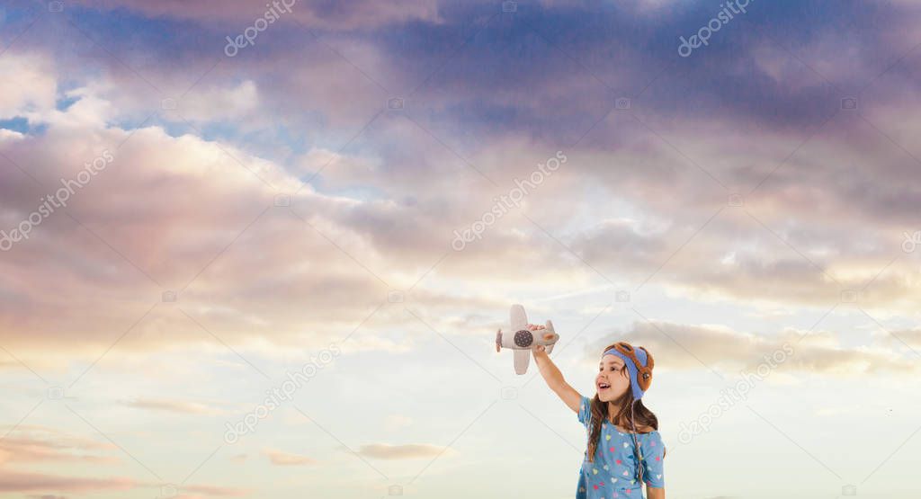 Smiling kid dreaming of becoming a pilot, future generation concept