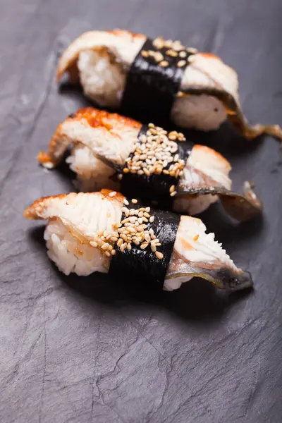 Unagi nigiri sushi set on the black slate — Stock Photo, Image