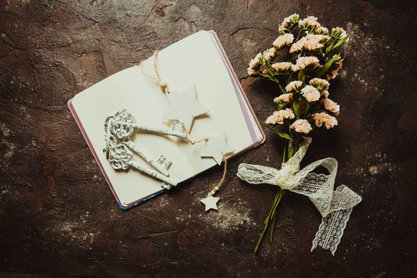 Op view of vintage notebook with keys, ribbon and bookmark — Stock Photo, Image