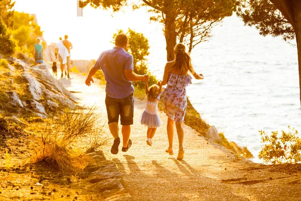 Happy family with kids walk at sunset beach — Stock Photo, Image