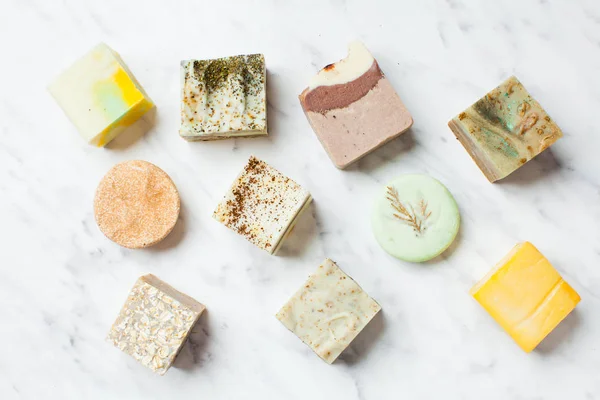 Top view of various handcrafted soap with different ingredients — Stock Photo, Image