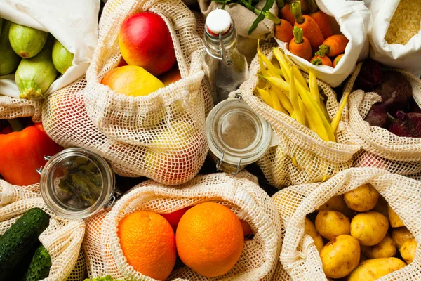 Vegetables and fruits in textile bags top view — Stock Photo, Image