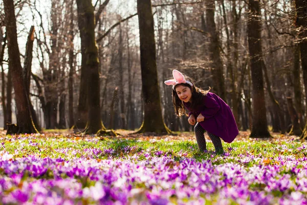 Little girl with banny ears in spring park — Stock Photo, Image