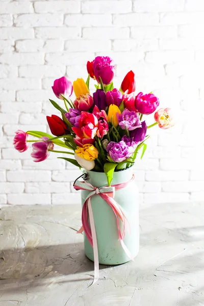 Metal vase with beautiful tulips in bloom — Stock Photo, Image