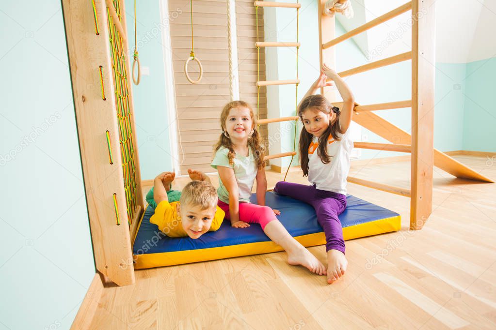 Children playing together in home kids gym