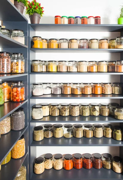 Shelf in a shop with colorful natural herbs and spices