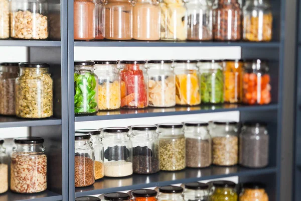 Shelf in a shop with colorful natural herbs and spices