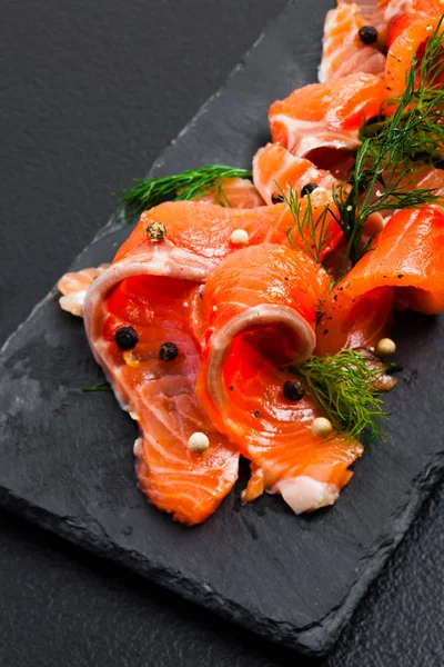 Smoked Salmon with peppercorns and dill close up — Stock Photo, Image