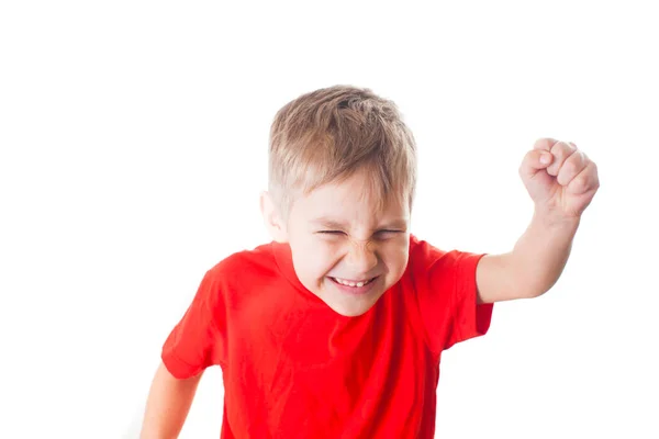 Lycklig liten pojke triumferat med upphöjd hand — Stockfoto