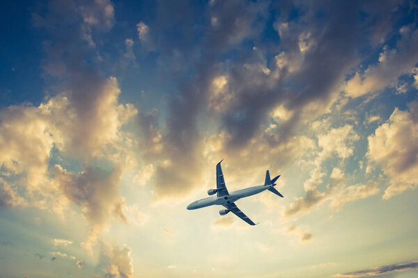 Airplane on blue sky and clouds, fly concept