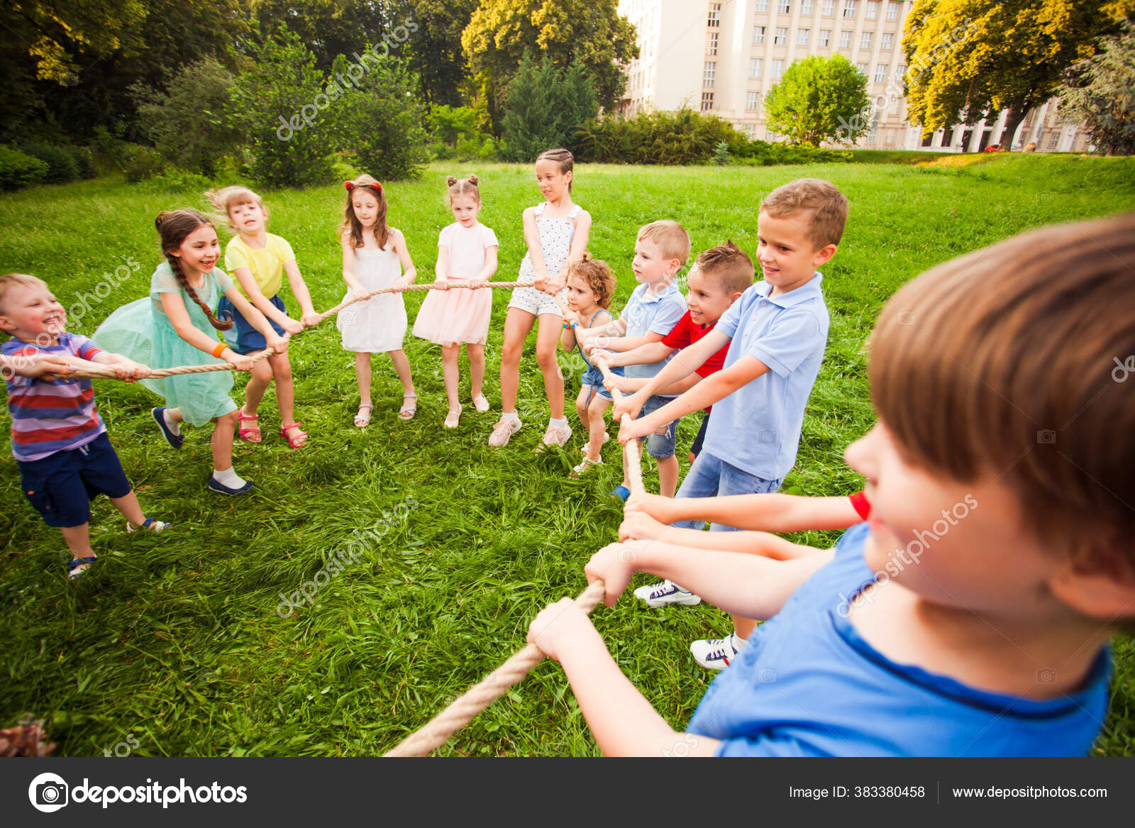 Children play with a rope in the park — Stock Photo © oksixx #383380458