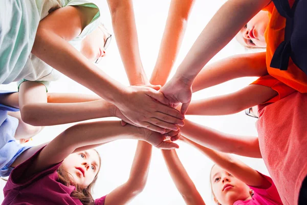 Little children putting their hands together outdoors, view from down. — Stock Photo, Image