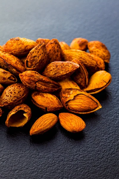 Close up shelled almonds on grey surface — Stock Photo, Image