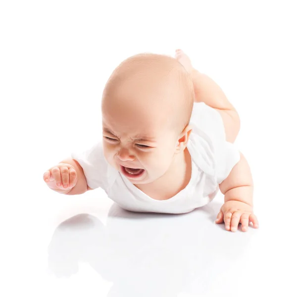 Crying baby lying on the stomach isolated — Stock Photo, Image