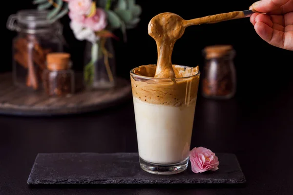 Fluffy instant coffee with cold milk in glass cup — Stock Photo, Image