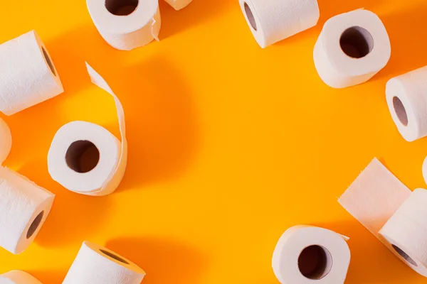 Top view of toilet paper rolls frame on the yellow — Stock Photo, Image