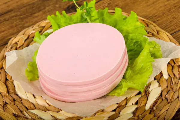 Sliced Sausage Salad Leaves Wooden Background — Stock Photo, Image