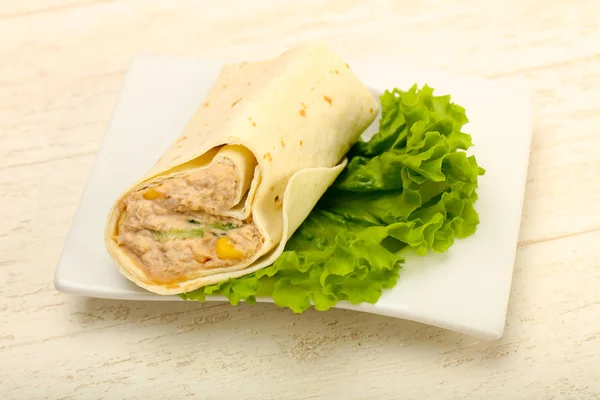 Tuna bread roll served with salad leaves