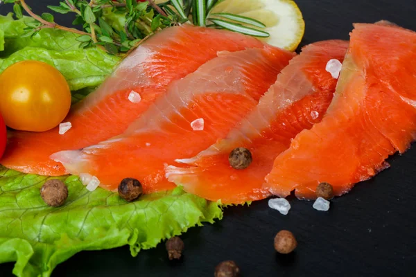 Raw trout fillet with salt and spices
