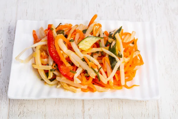 Delicious asian salad with marinated bamboo shoots and vegetables