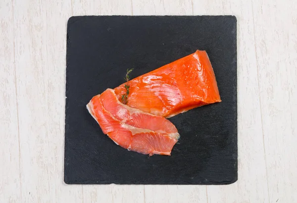 Raw trout fillet with salt and spices