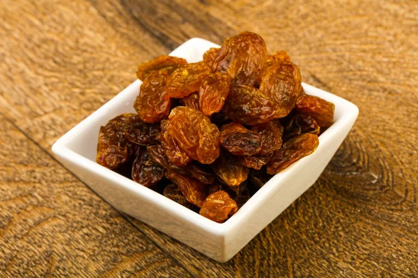 Raisin Sec Dans Bol Sur Fond Bois — Photo