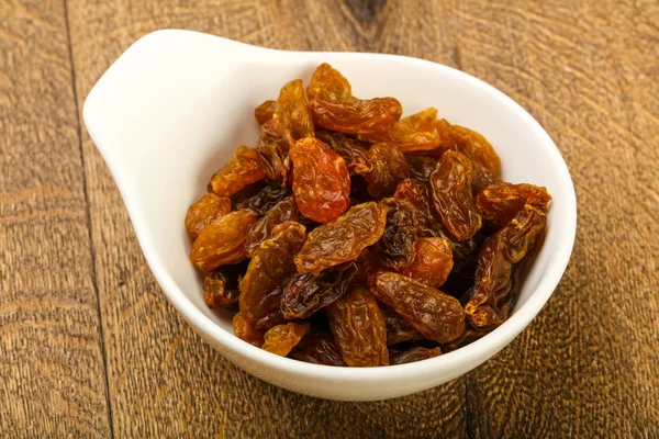 Raisin Sec Dans Bol Sur Fond Bois — Photo