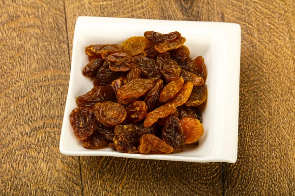 Raisin Sec Dans Bol Sur Fond Bois — Photo