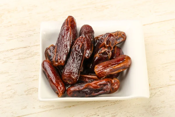 Sweet dates fruit heap in the bowl