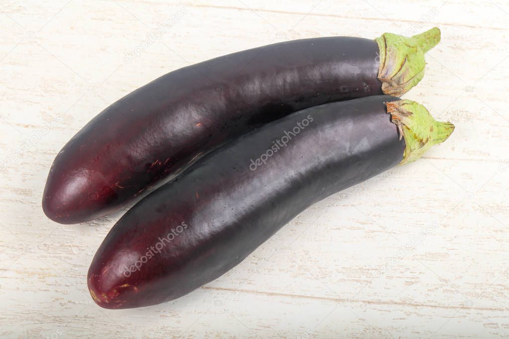 Two Eggplants on the wooden background