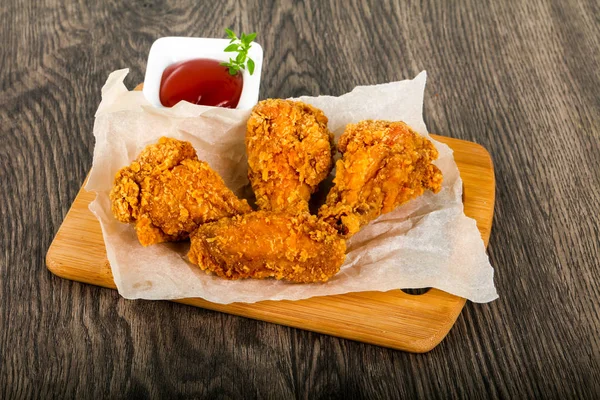 Crispy chicken wings with  ketchup