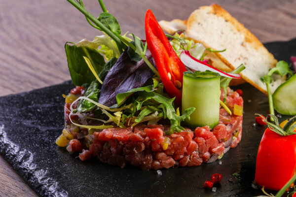 Raw beef tartar served quail egg