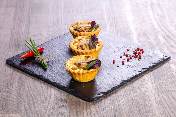 Canape with baked mushroom and cheese