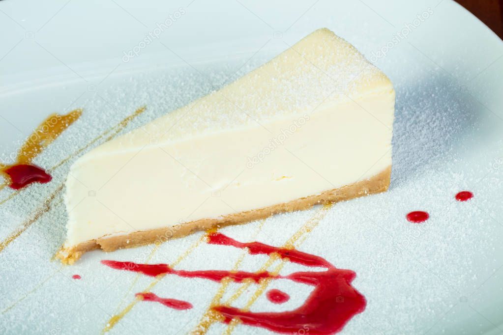 Sweet Cheesecake with syrope in the plate