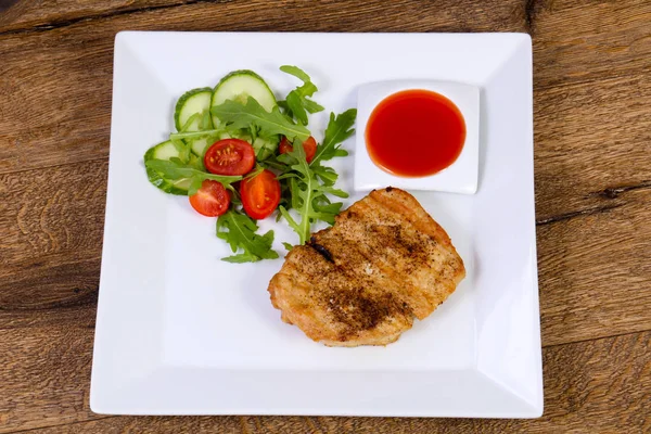 Grilled pork with sauce and salad dressing