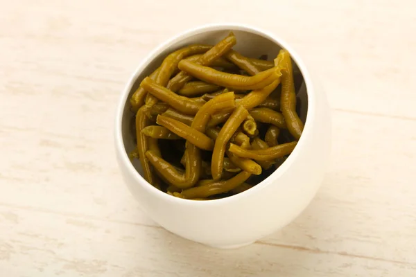 Canned Green beans on white table