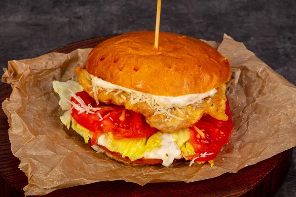 Burger with chicken and tomatoes