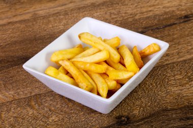 Patates kızartması patates ahşap arka plan üzerinde